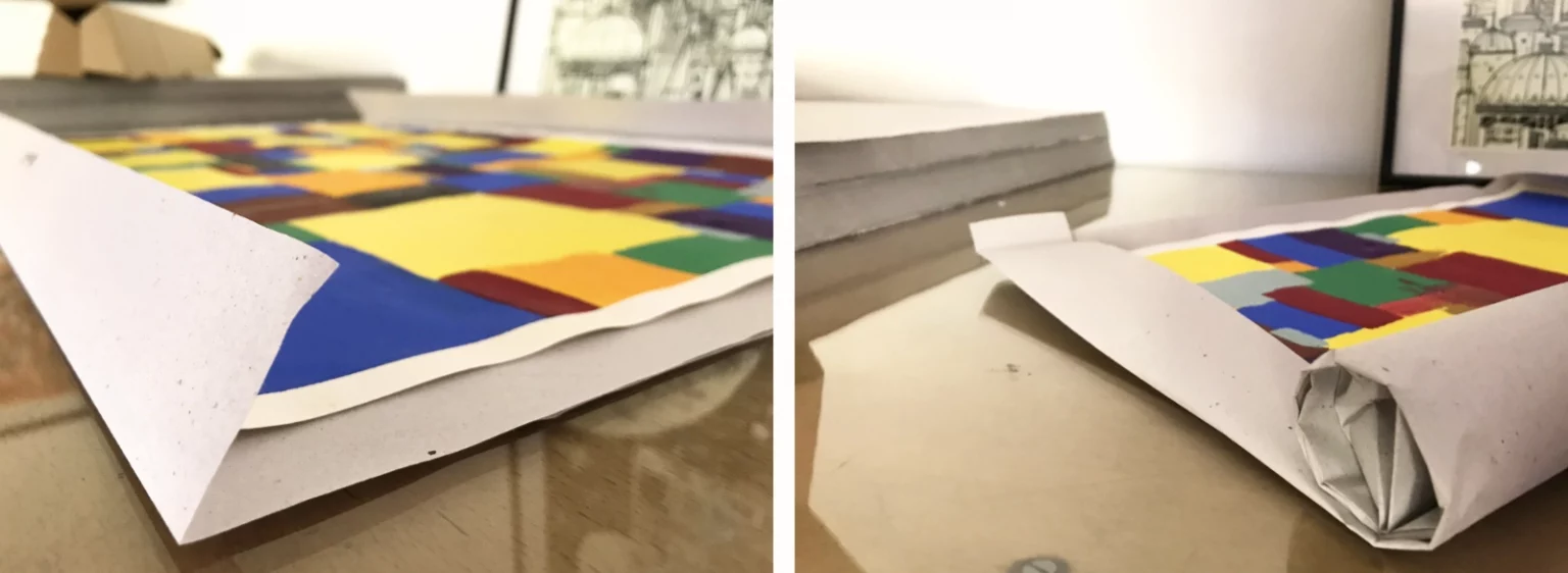 Poster wird sorgfältig mit Seidenpapier umgeknickt und eingerollt – sicherer Versand aus dem Fiete Rakete Shop.