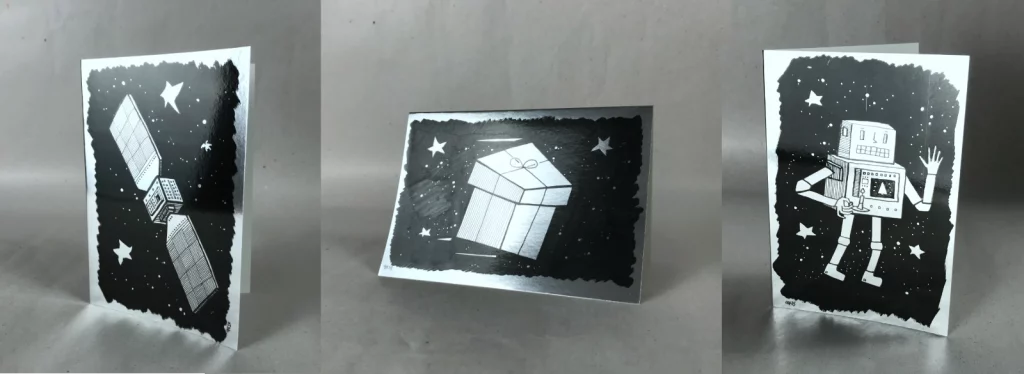 Weihnachtskarte 2025 auf chromsilbernem Karton, Hauptansicht, modernes Schwarz-Weiß-Motiv, limitierte Edition von Fiete Rakete.